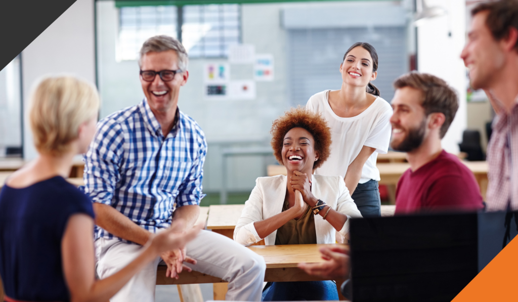 6 employees gathered in a meeting room discussing mental health in the workplace